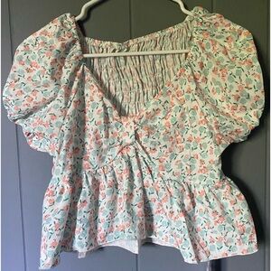 Peplum top with puffed sleeves